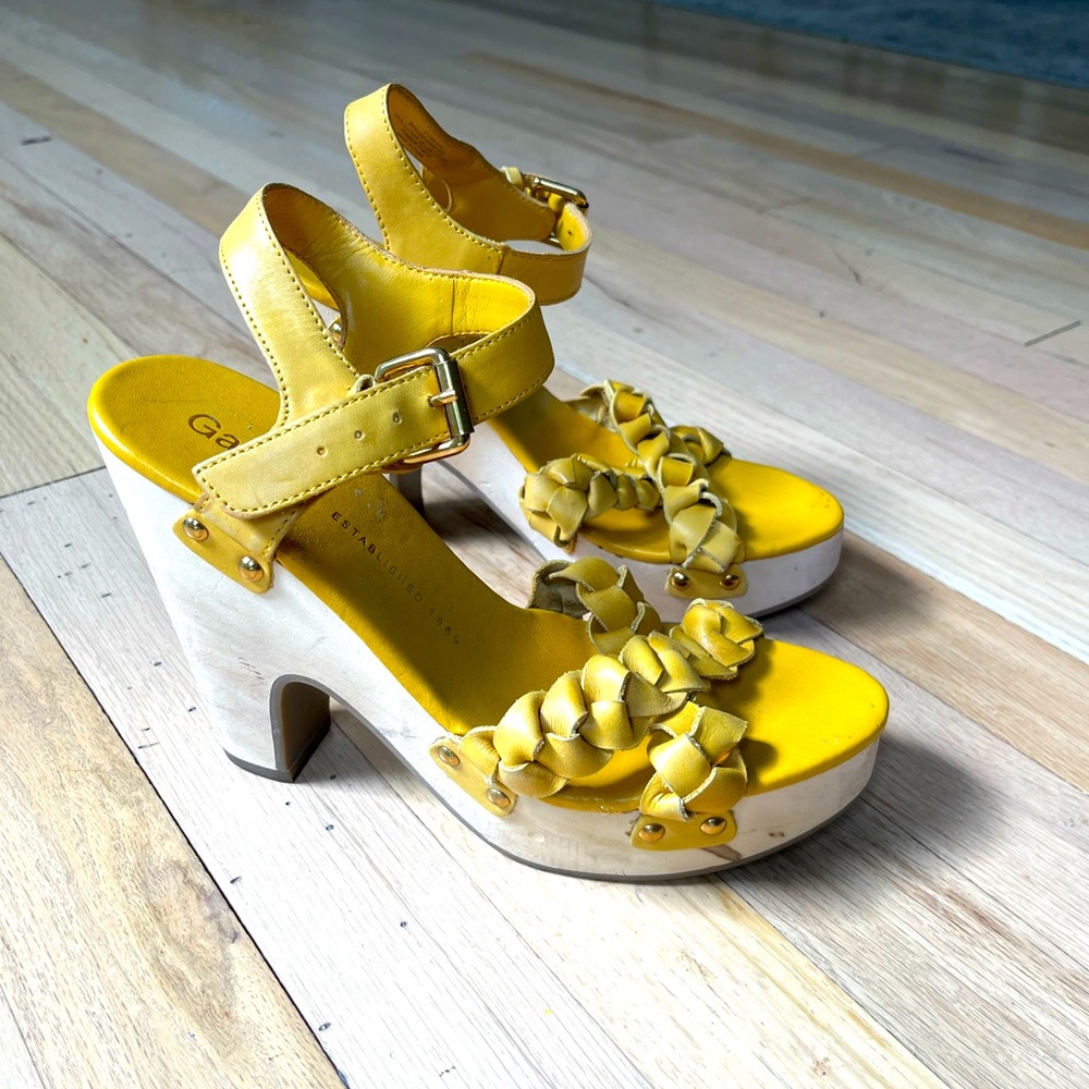 Size 7, 4” wooden platform sandal. Mustard yellow woven leather straps